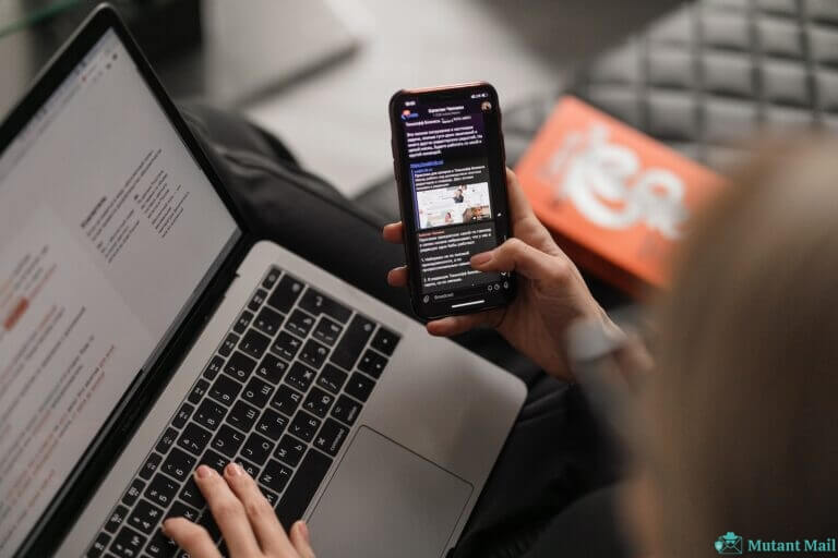 person holding black iphone 4