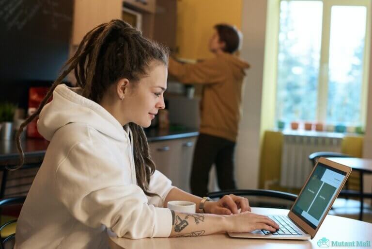 Shallow Focus Photo of Woman Using a Laptop