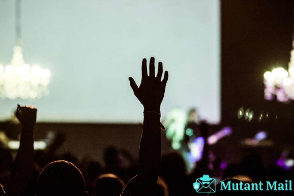 silhouette photography of human hand raising